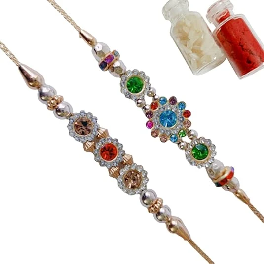 Raksha Bandhan Combo of 2 Designer Multicolor Rakhis for Brother with Roli Tilak bottle Set in Beautiful Cushion & Zipper Pouch Packing.